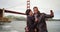 A black couple poses for a picture near the Golden Gate Bridge