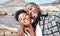 Black couple, selfie and smile for happy beach fun, carefree and relaxing sunny day outdoors. Portrait of love, summer