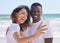 Black couple smile, selfie and sea water with a woman and man together for social media profile picture. Love, care and