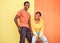 Black couple, smile and urban portrait by wall with edgy fashion, happy and bonding with color. Gen z, happy couple and