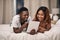 Black couple, tablet and bed in home for relax entertainment or streaming movie for resting, bonding or subscription