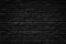 Black cracked old rough brick tiles wall background