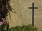 Black cross on granite background tombstone