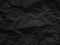 Black crumpled paper texture background