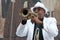 Black cuban musician playing the trumpet