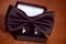 Black cuff links and bowtie