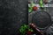 Black culinary background with spices and vegetables on the table. Top view.