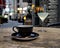 Black cup of cofee glass of wine table top at summer night street medieval city people relaxing in Tallinn Old town travel to Est