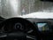 Black dashboard seen from driver perspective driving in italian mountains in poor road conditions
