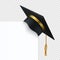 Black degree ceremony hat with white banner. 3D realistic graduation cap with gold ribbon and tassel. Vector headdress