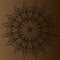 Black, delicate, circular pattern, mandala on a brown background