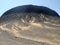 Black desert volcanic hill in Egypt, near Farafra