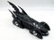 Black diecast Batmobile isolated on white background
