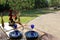 Black dinnerware and blue glasses for romantic cookout with greenery and flower and heart decoration on valentines day glamping