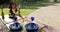 Black dinnerware and blue glasses for romantic cookout with greenery and flower and heart decoration on valentines day glamping