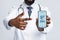Black doctor showing smartphone with Immune digital passport for covid-19