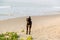 A black dog on sand beach. Accommodation for dogs of some place, resort, hotel is concept. Law on stray dogs in public place is c