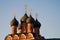 Black domes of the Orthodox Church with golden crosses