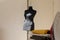 Black dressmaker mannequin on white background