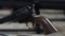 Black drum revolver with a wooden handle. Weapon pistol. Black handgun.