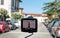 Black DVR on the windshield of the car with a street view, where are the cars on a Sunny day
