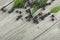 Black elderberry with green leaves on wooden desk, top view. Elder plant berries. European black elderberry