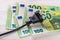 Black electric plug on one hundred euro banknotes. Rise in electricity prices concept