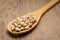 Black Eyed Pea legume. Spoon and grains over wooden table.