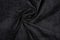 Black fabric texture - close-up of a piece of crushed and twisted black linen