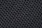 Black fabric texture with pattern, with sagging inside the ovals. The texture of the fabric