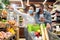 Black Family Buying Food Walking With Cart In Grocery Shop