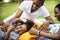 Black family enjoying summer together at backyard