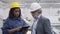 Black female factory employee with tablet