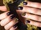 Black female manicure nails closeup with crown