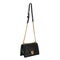 Black female small bag with a long gold chain
