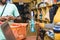 black female supermarket attendant using a barcode scanner to checkout a customer& x27;s item