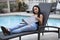 Black Female Tourist Reading a Hotel Brochure