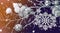 Black festive Christmas background with contrasting white objects - natural painted white branch, snowflakes, Christmas toys,