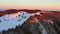 Black Forest landscape at sunrise in winter, trees illuminated by sunlight on top of snow-covered mountain