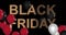 Black Friday advertisement with golden sign and black and red balloons, background 4k animation seamless loop