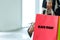 Black Friday.  Close up hand lifestyle asian woman holding many shopping bags while walking in the shopping mall.