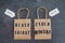 Black friday and cyber monday shopping bags with Offline and Online signs