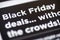 Black Friday Deals text on shopping app on smartphone screen closeup