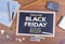 Black Friday sale. Chalkboard on wooden office desk