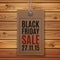 Black Friday sale. Price tag on wooden planks