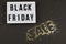 Black friday sale text on white lightbox, golden stars around with inscription discounts on black background