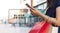 Black Friday, Woman using smartphone carrying shopping bags