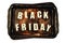 Black Friday the writing is a word lined with letters on an old rusty metal tray.