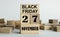 Black Friday is written on wooden cubes stacked in the form of a mobile calendar
