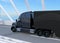 Black Fuel Cell Powered American Truck driving on highway